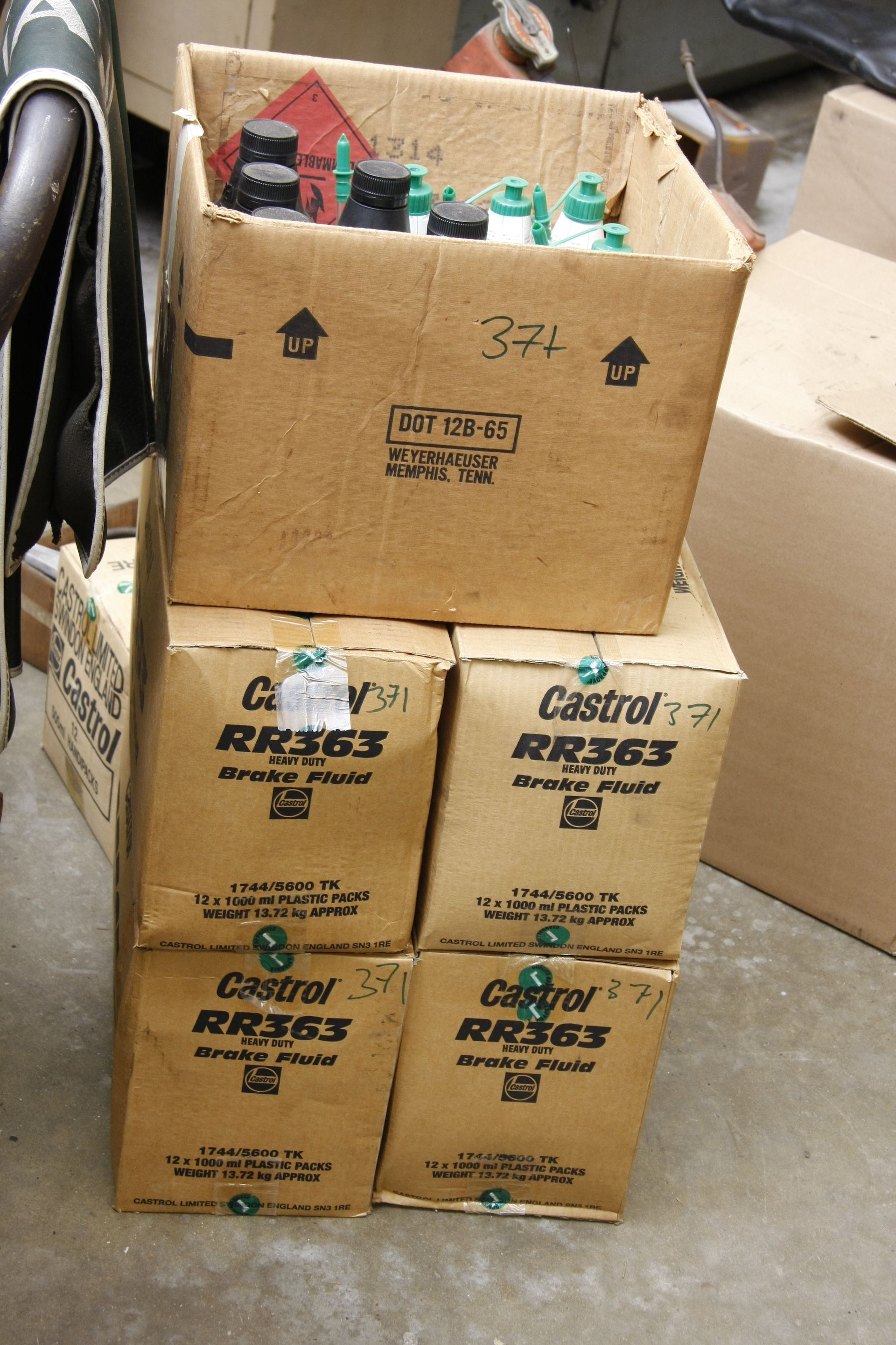 Bonhams Cars A large quantity of new fluid bottles for use on Rolls