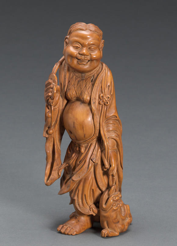 Bonhams : A carved boxwood figure of Liu Hai