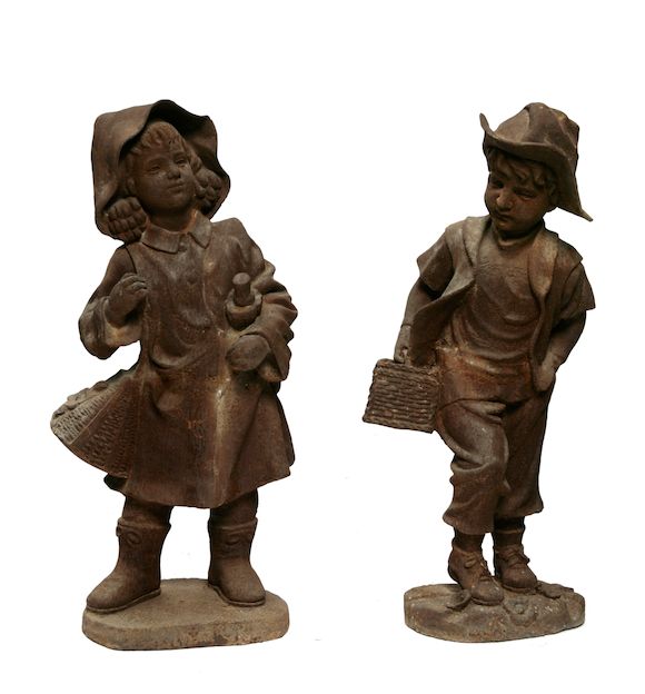 Bonhams A pair of cast iron garden figures of children