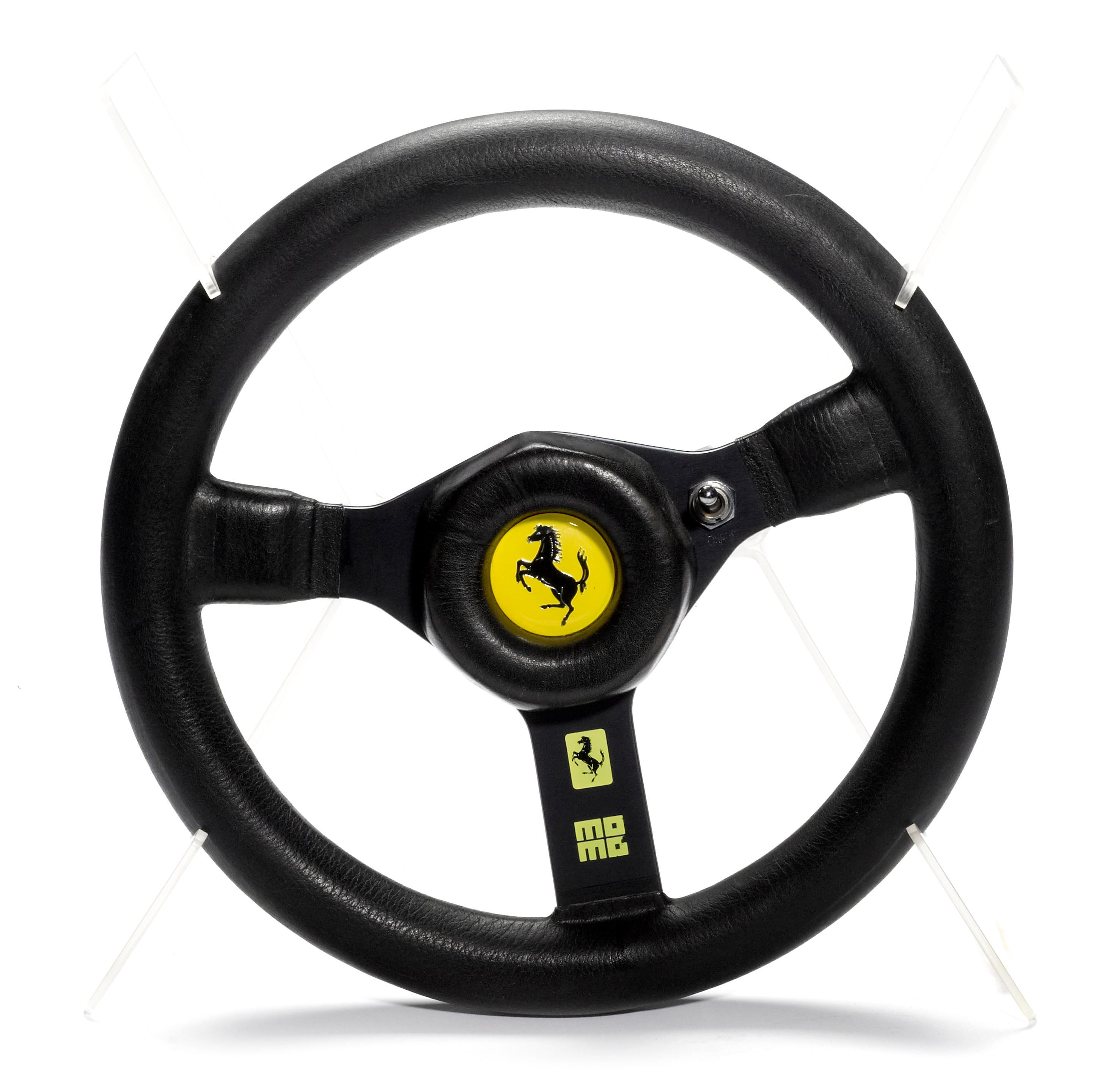 bonhams-cars-a-good-ferrari-f1-steering-wheel-by-momo