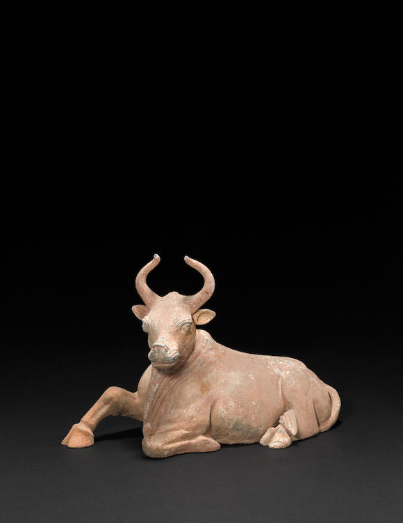 Bonhams : A painted pottery model of a recumbent ox Tang dynasty