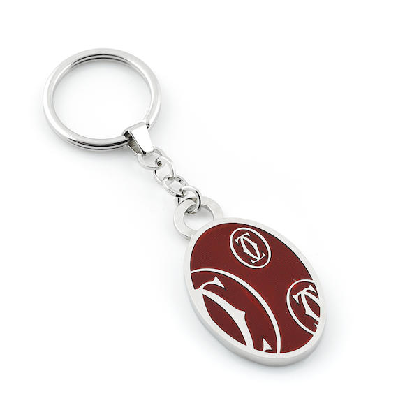 Bonhams : An enamel and silver Happy Birthday keychain, Cartier