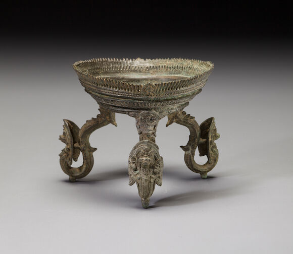 Bonhams : A copper alloy ritual conch stand Cambodia, 12th/13th century