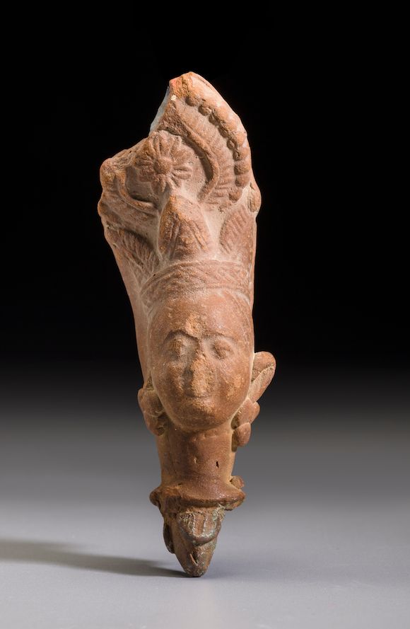 Bonhams A terracotta head of a deity Uttar Pradesh, India, Circa 3rd