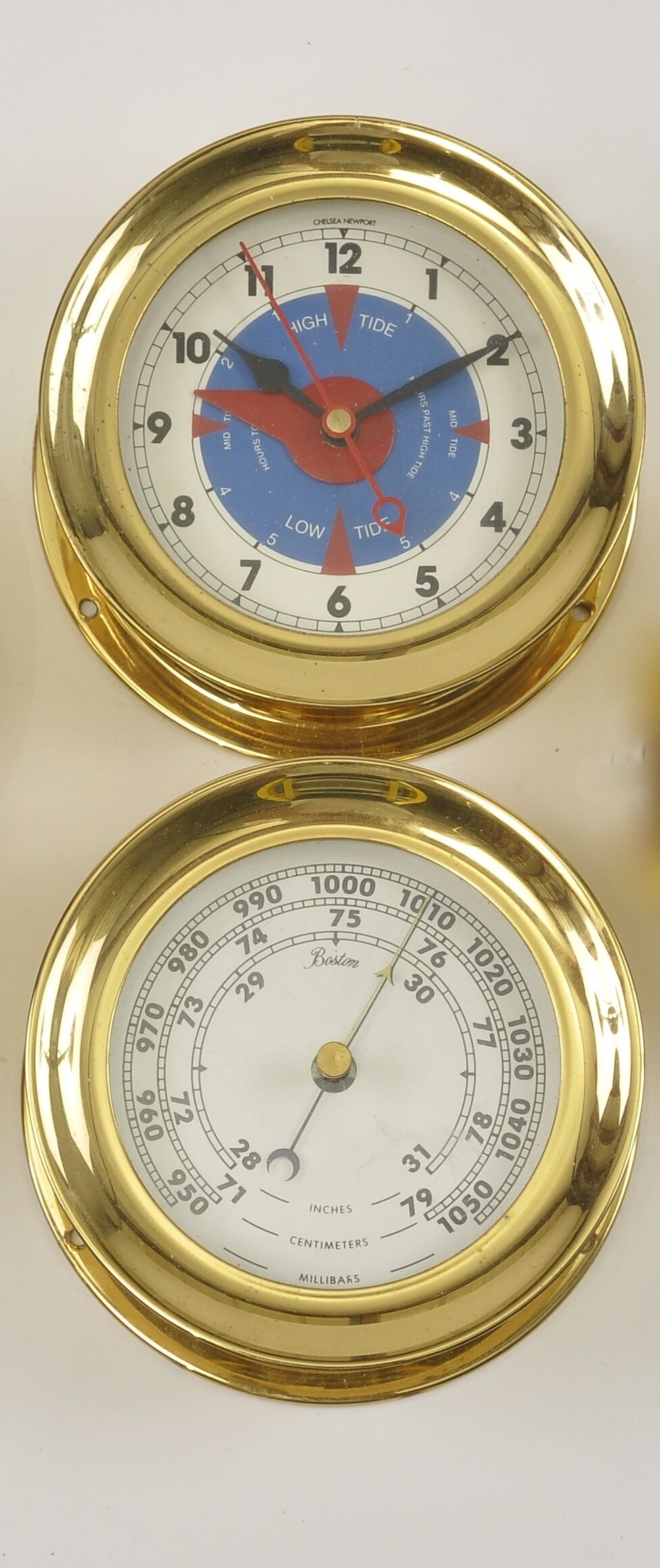 Bonhams A Chelsea Newport time and tide clock with a barometer 20th