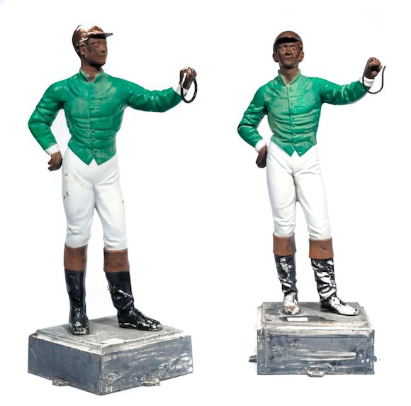 Bonhams A pair of paint decorated cast iron lawn jockeys