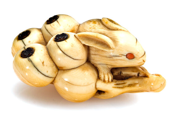 Bonhams : An ivory netsuke of a rabbit on a branch of loquats Edo ...