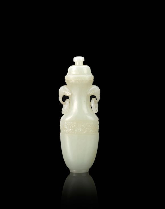 Bonhams A white jade lidded vase with elephant handles