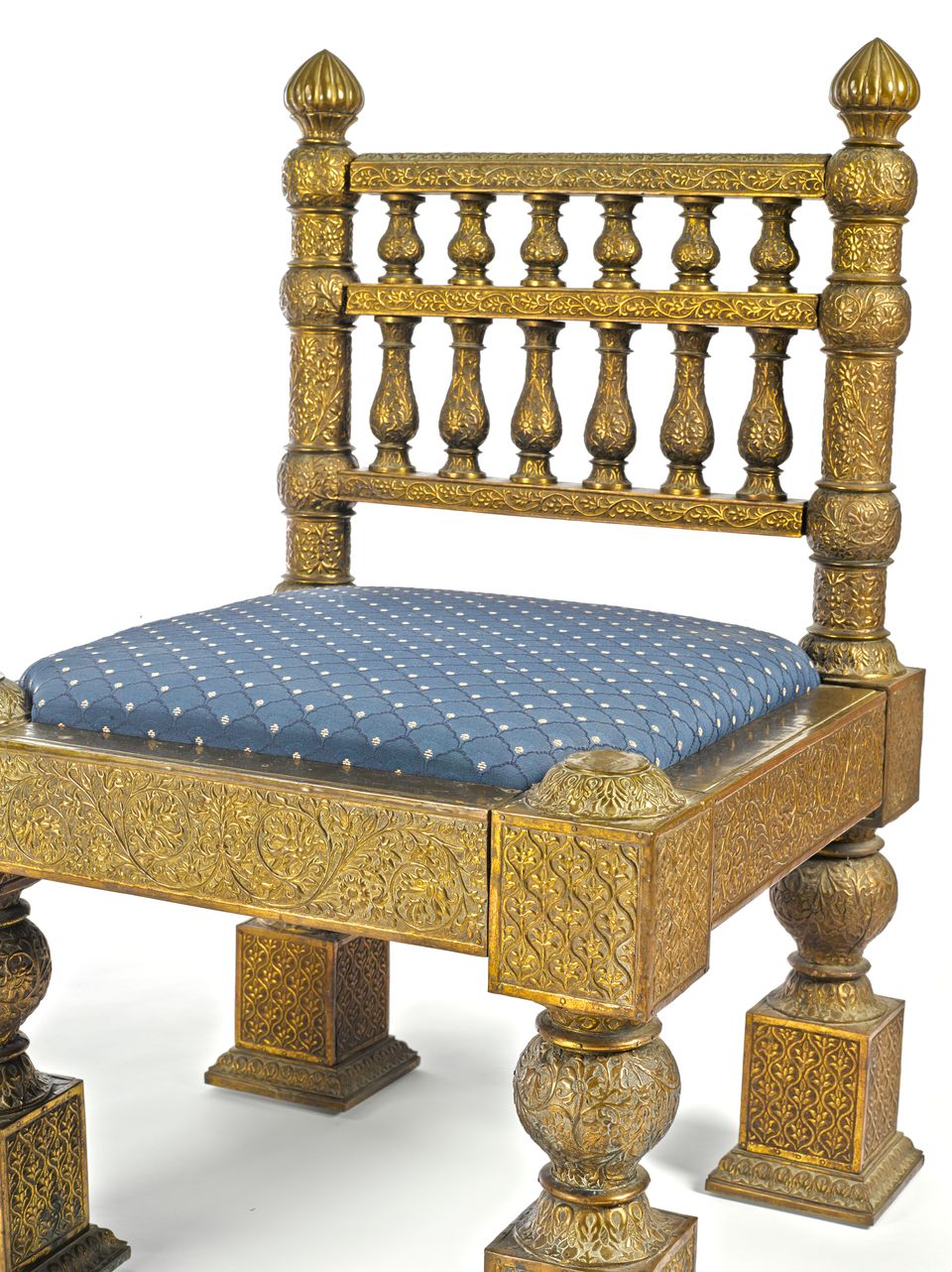 Bonhams A pair of chased brass overlaid teak side chairs designed by