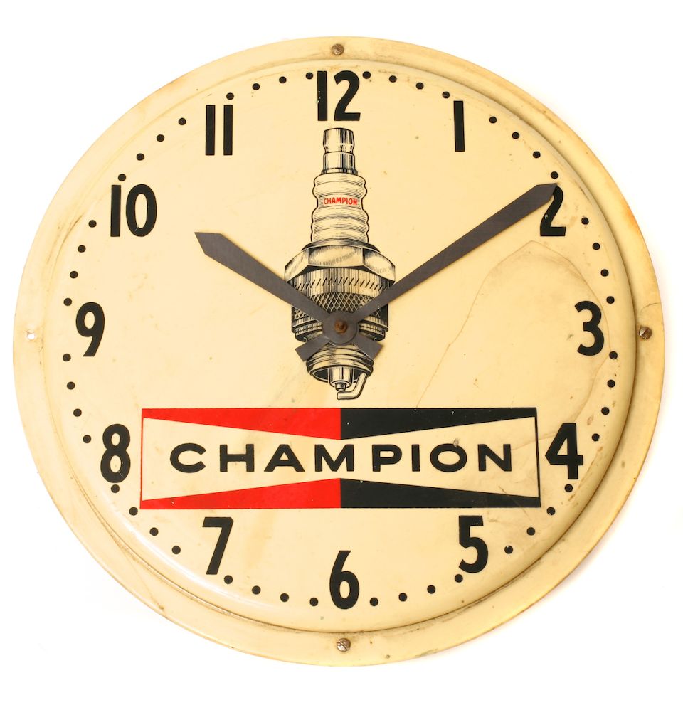 Bonhams A grouping of Champion spark plugs wall clocks,