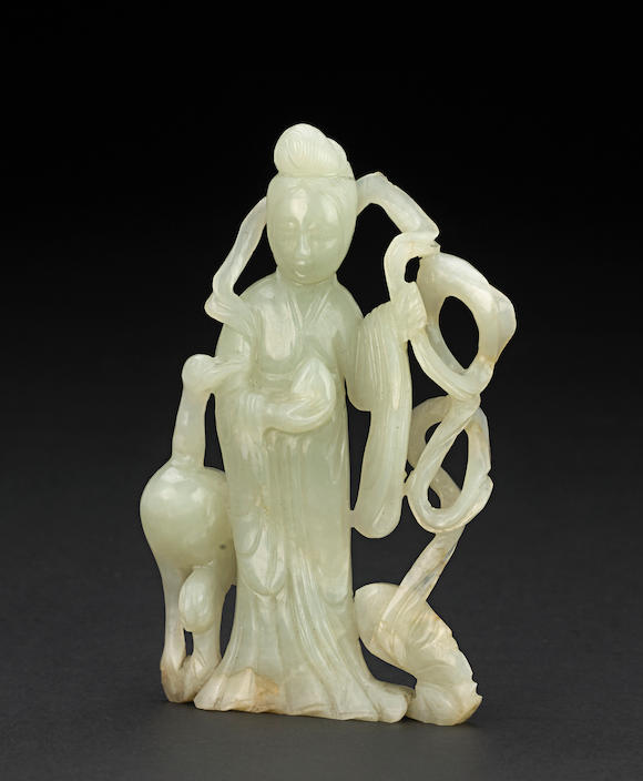 Bonhams : A small reticulated jade figure of a female immortal Late ...