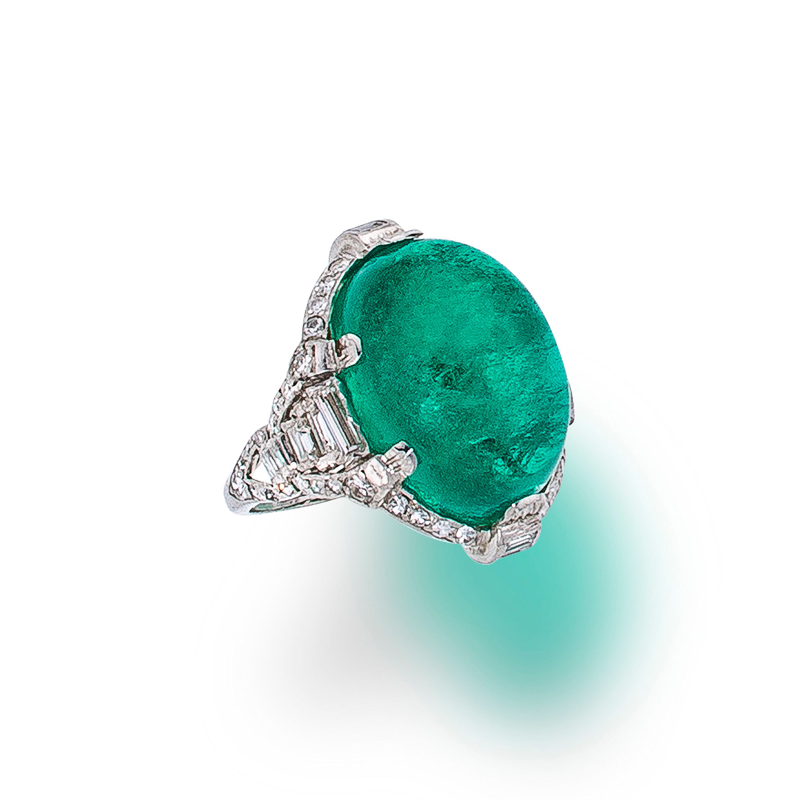 An emerald and diamond ring