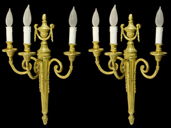 Bonhams : A pair of Louis XVI style gilt bronze three light bras de ...