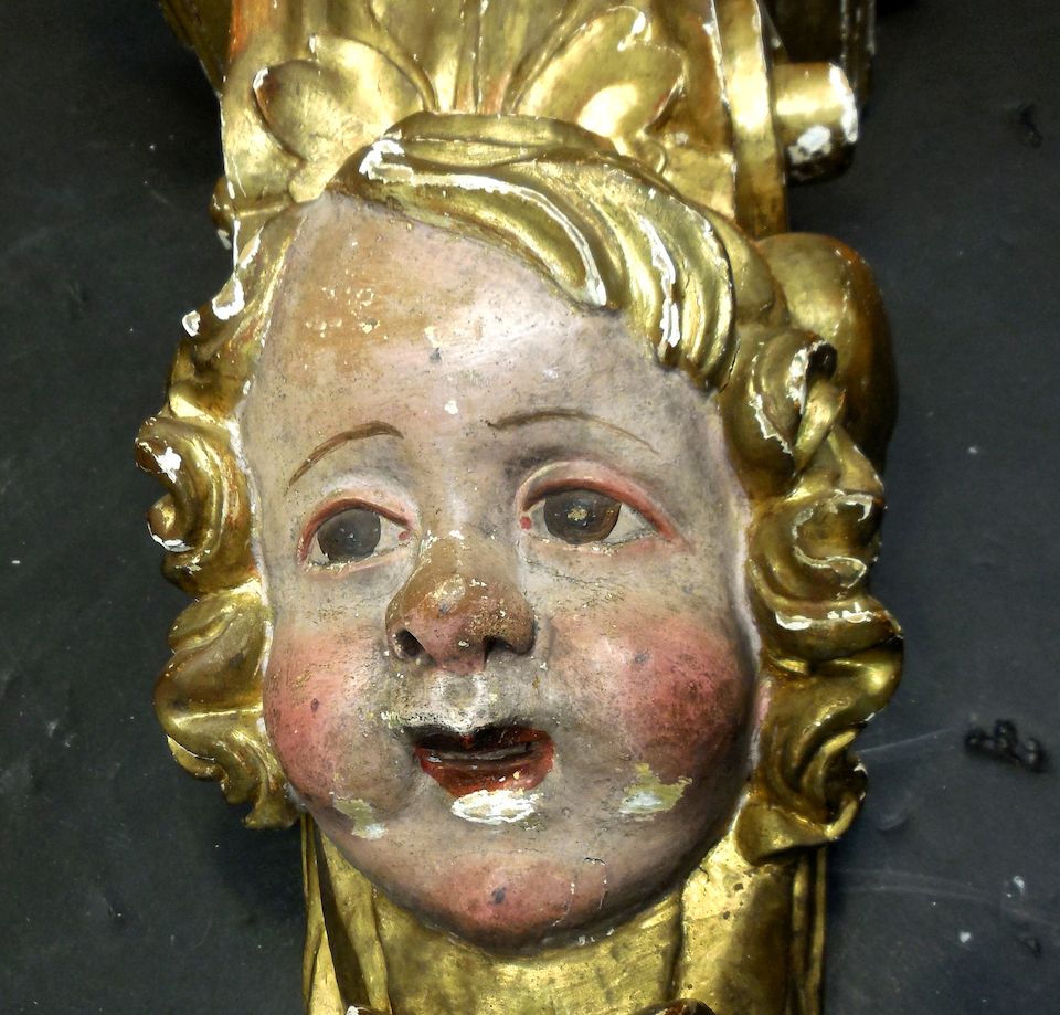 Bonhams A pair of Italian Rococo polychrome and parcel giltwood