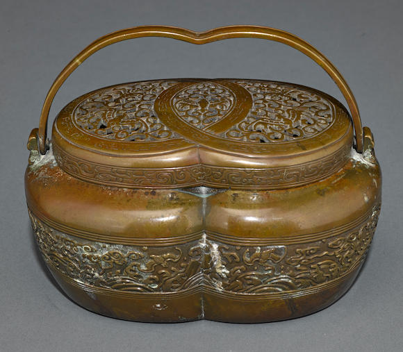 Bonhams : A patinated bronze hand warmer Qing dynasty