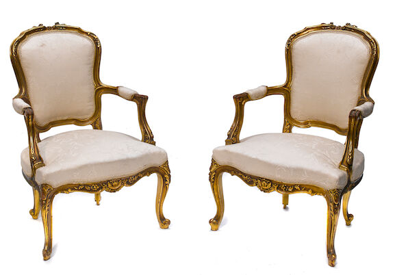 Bonhams : A pair of Louis XV style carved giltwood fauteuils