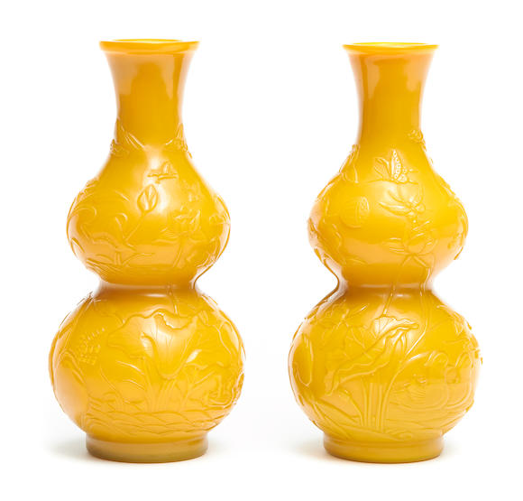 Bonhams : A pair of carved yellow Peking glass double-gourd vases