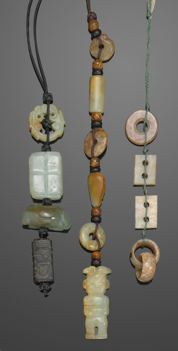 Bonhams : Three strings of jade and hardstone decorations