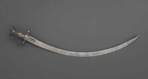 Bonhams : An Indian tulwar with silver and gold damascened hilt