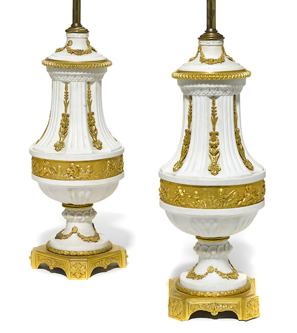 Bonhams : A pair of French gilt bronze mounted bisque porcelain table ...