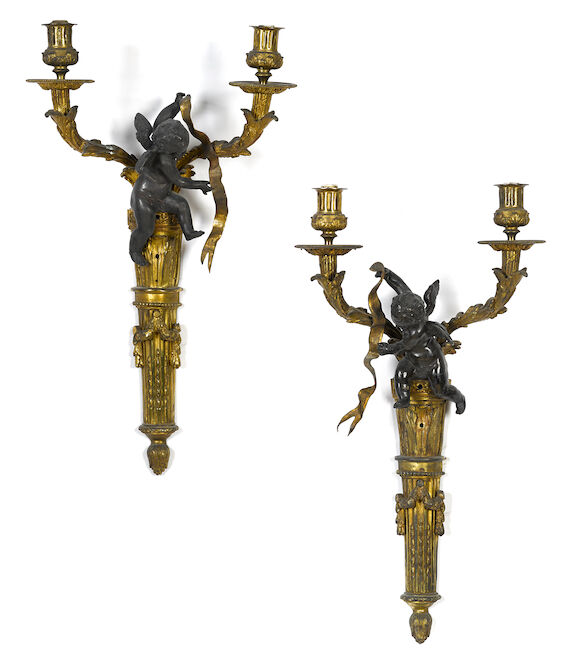 Bonhams : A pair of Louis XVI style gilt and patinated bronze two light ...