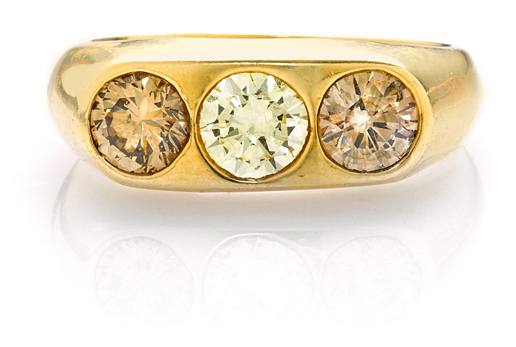 A colored diamond three-stone ring