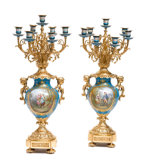 Bonhams : A pair of French gilt bronze and porcelain seven light ...