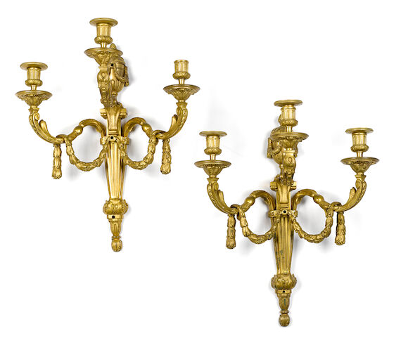 Bonhams : A pair of Louis XVI style gilt bronze three light bras de ...