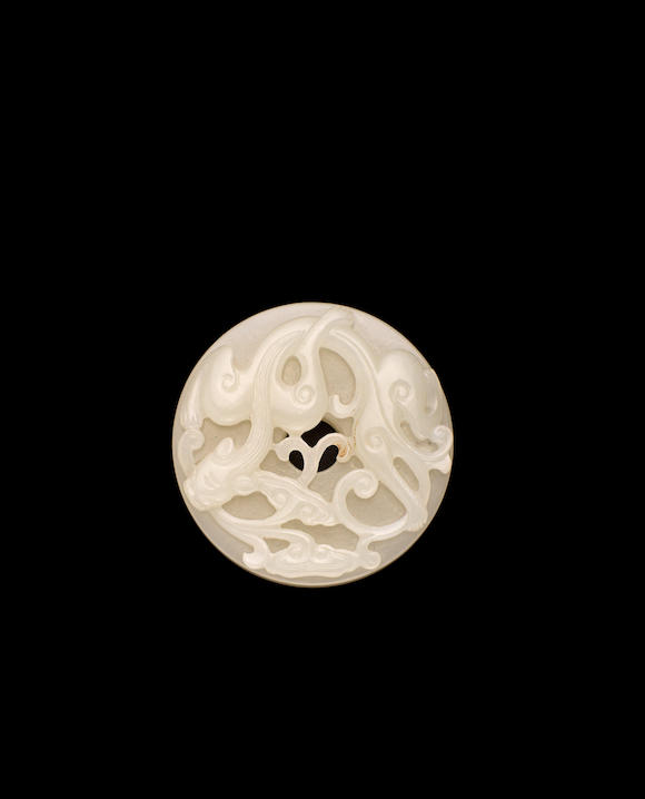 Bonhams : A white jade bi disc with chilong design Qing dynasty