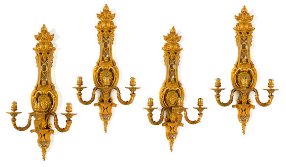 Bonhams : A set of four Régence style gilt bronze three light bras de ...