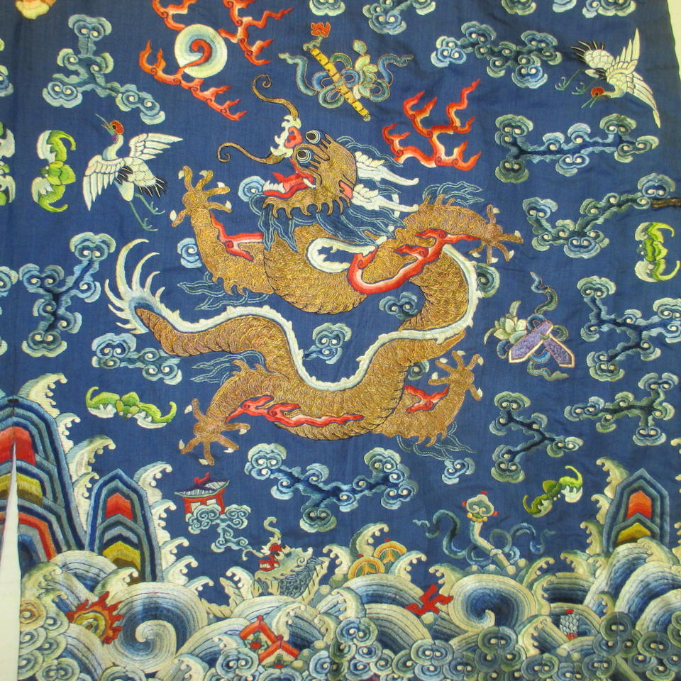 Bonhams : An embroidered blue silk ground dragon robe Late Qing dynasty