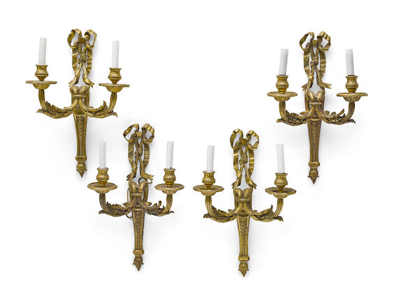Bonhams : A set of four Louis XVI style gilt bronze two light bras de ...