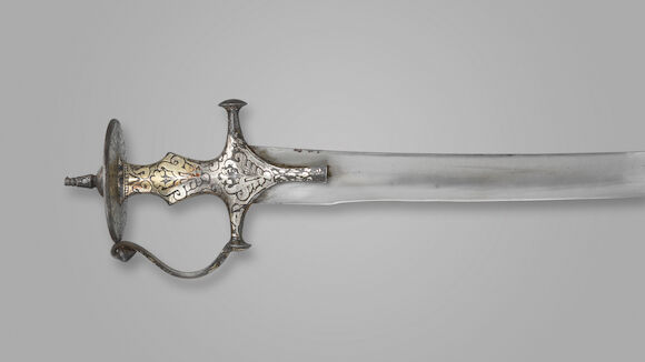 Bonhams : An Indian tulwar with silver damascened hilt