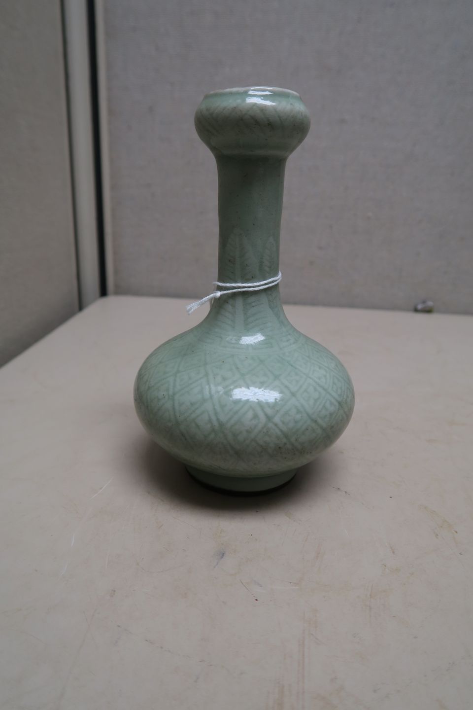 Bonhams A small celadon glazed garlichead vase 19th century