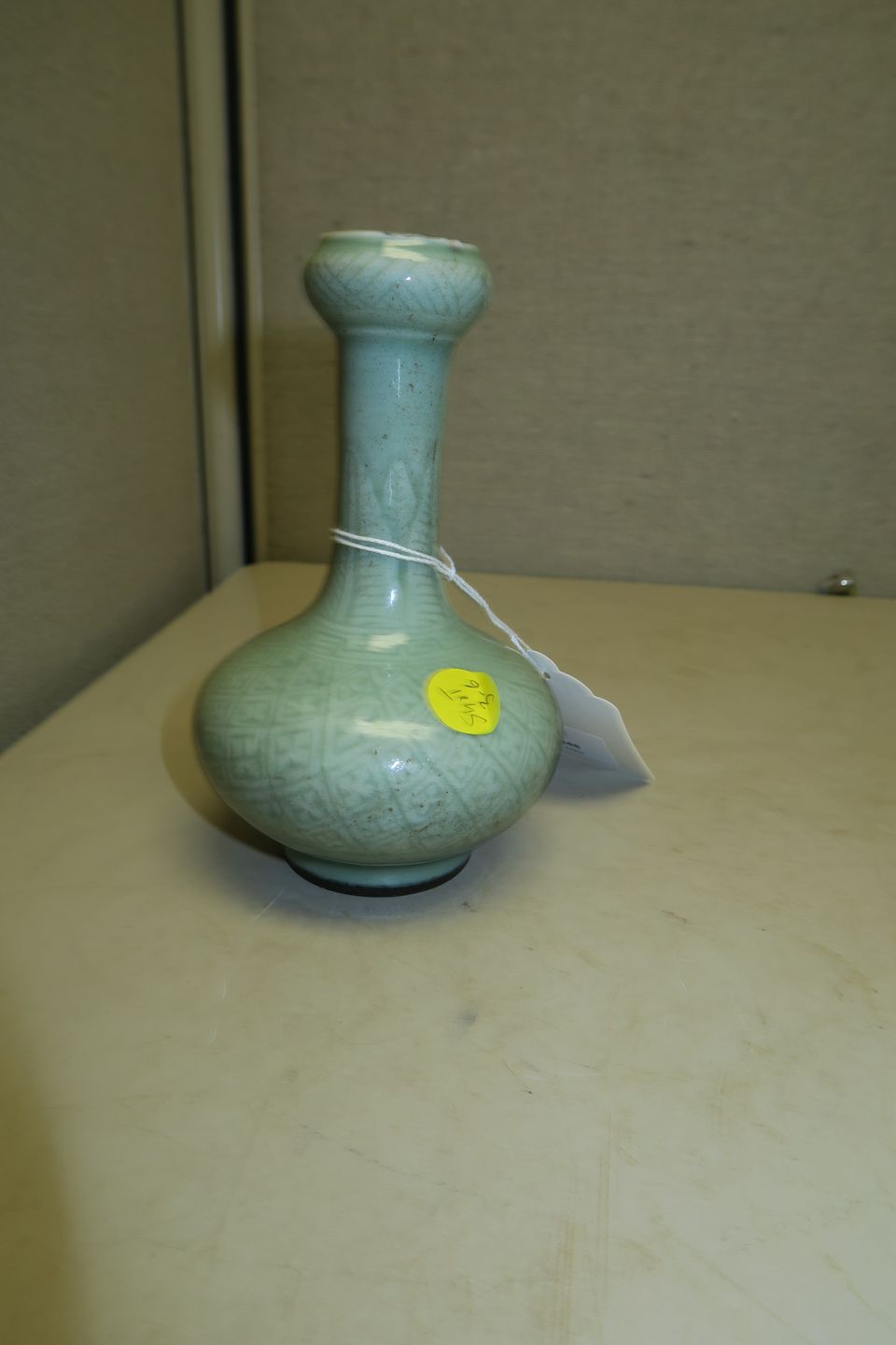 Bonhams A small celadon glazed garlichead vase 19th century