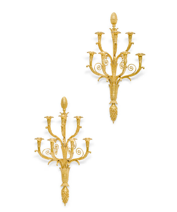 Bonhams : A pair of Empire style gilt bronze seven branch wall lights