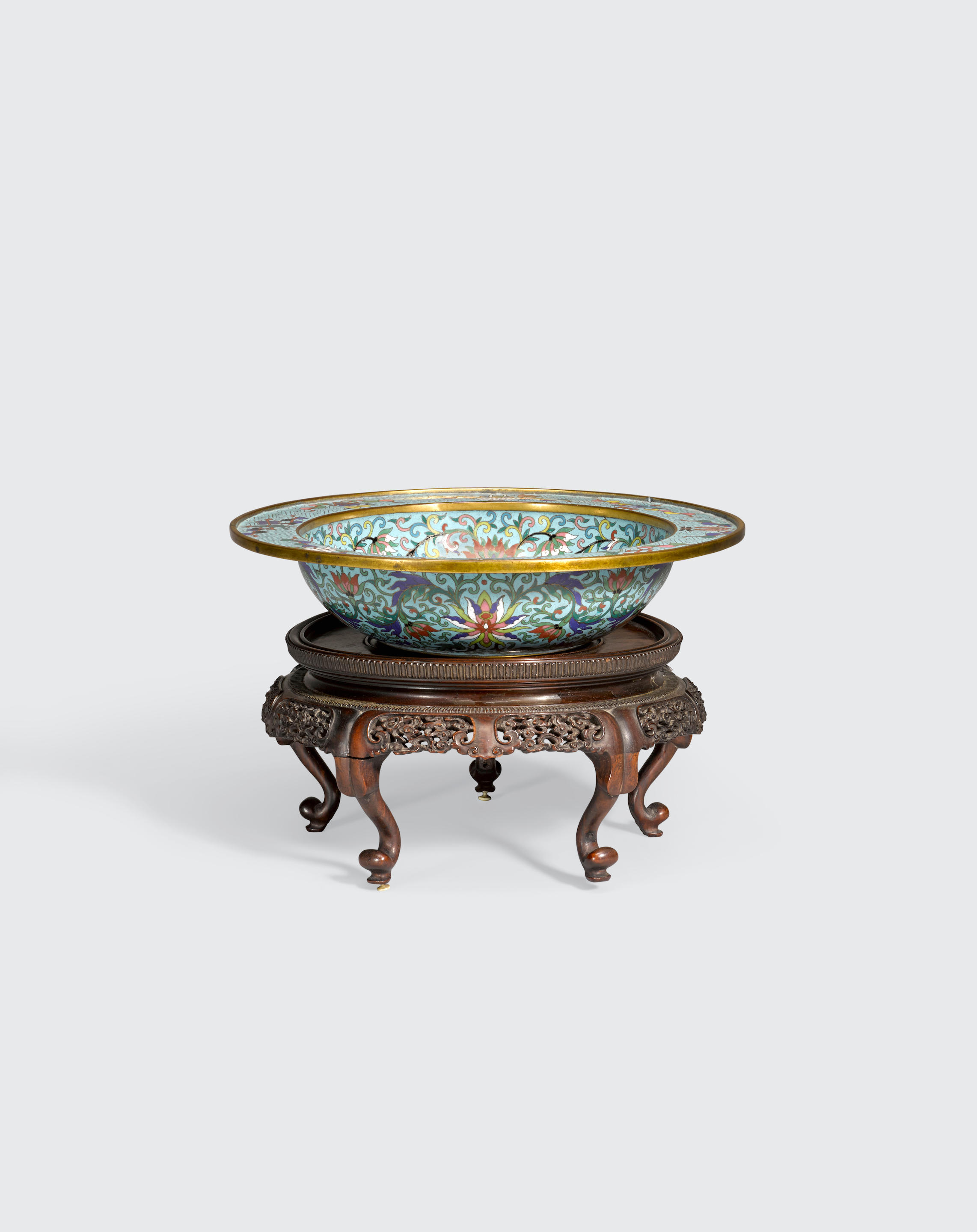 A small cloisonné enameled basin and a pieced wood stand
