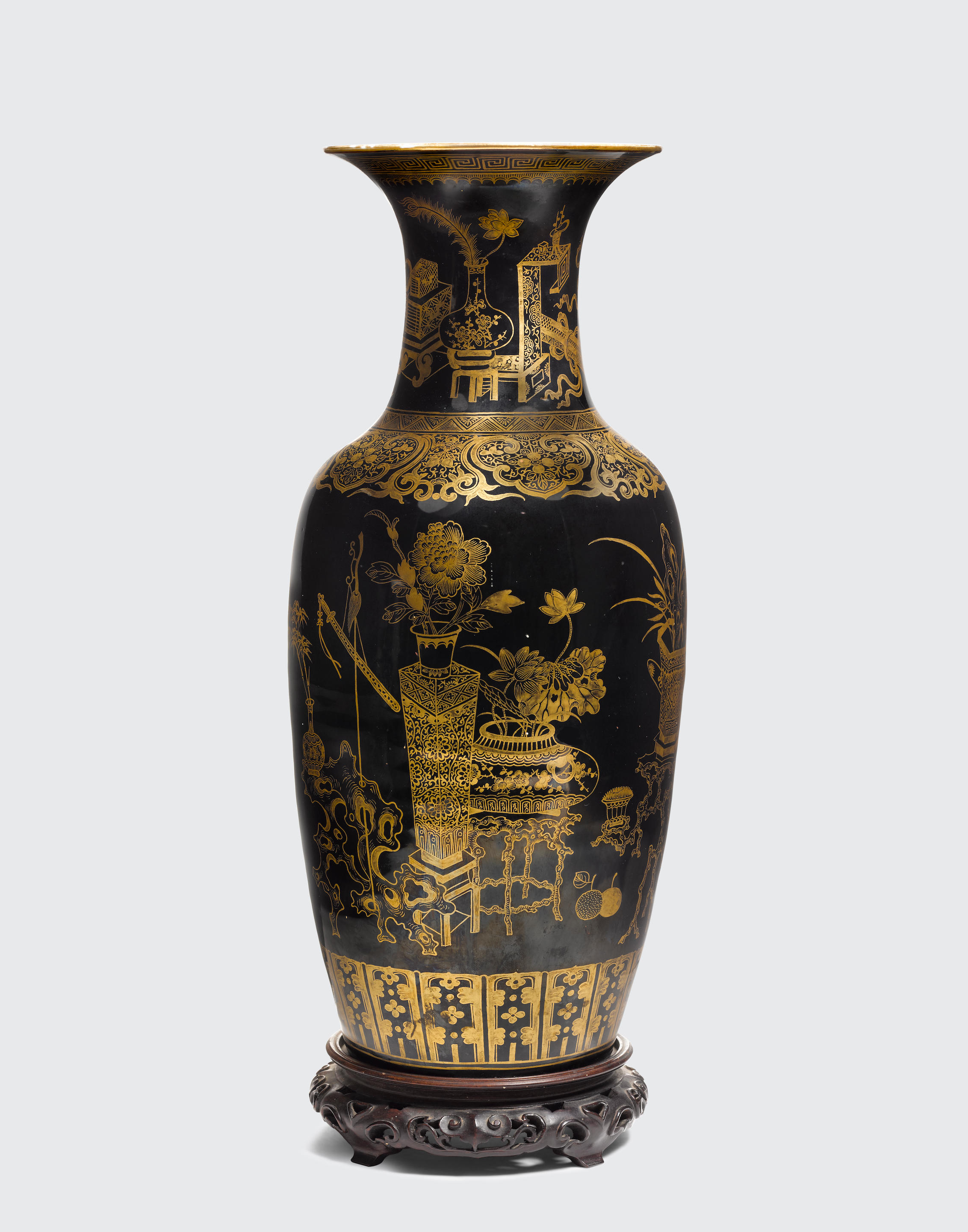 A mirror black and gilt-decorated baluster vase