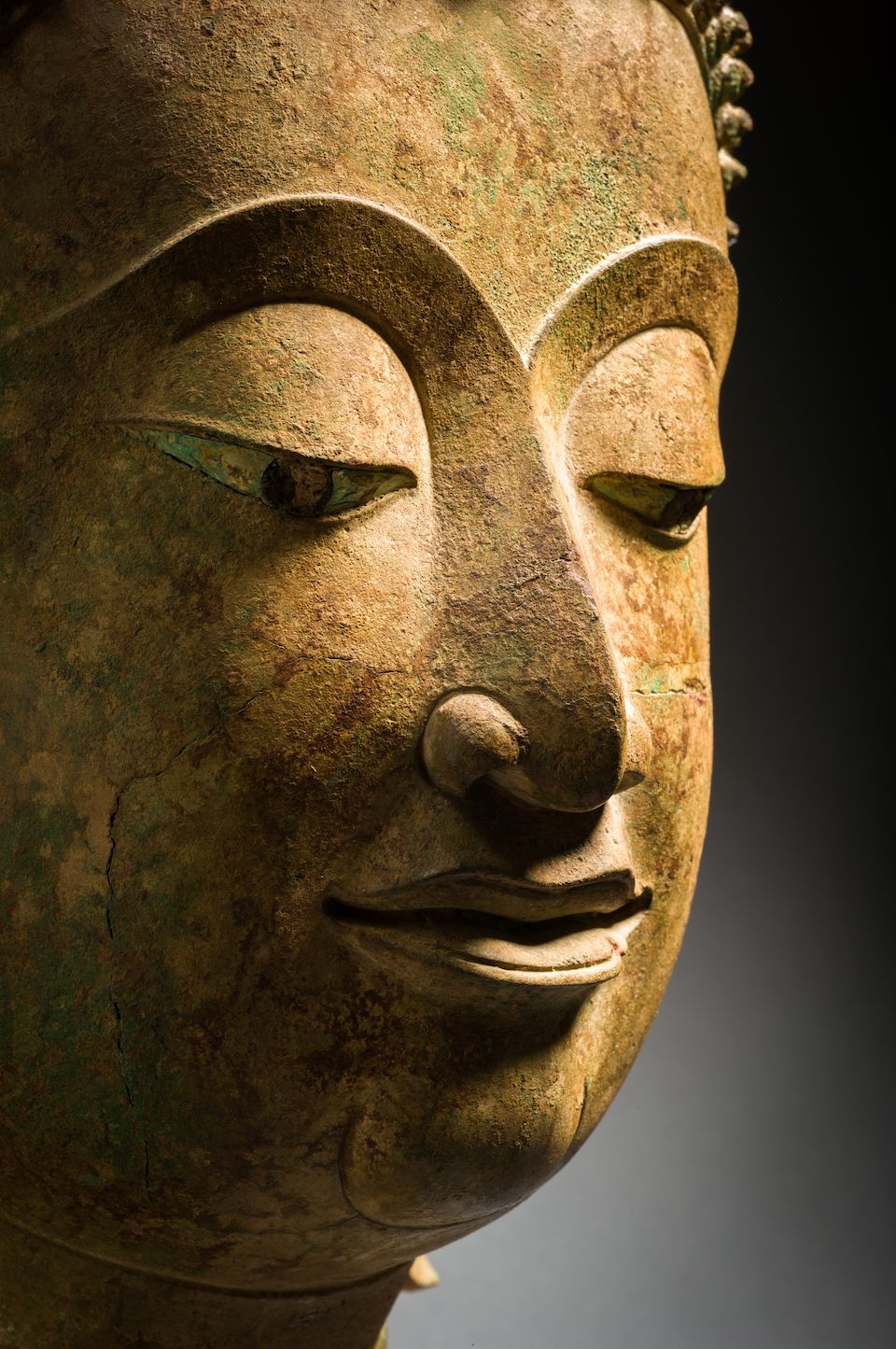 Bonhams A LARGE COPPER ALLOY HEAD OF BUDDHA THAILAND, CIRCA 16TH CENTURY