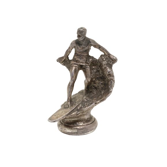Bonhams An early surfing hood ornament 1920s, white metal, 6 inches high, in the form of a