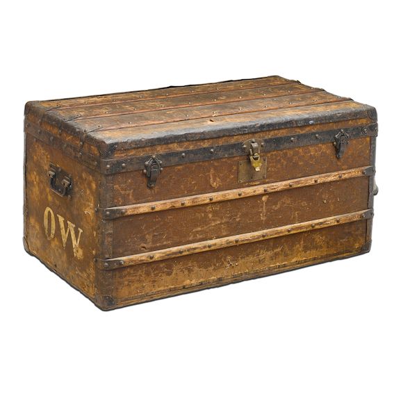 Bonhams A FRENCH WOOD AND LEATHER MOUNTED CHECKERED STEAMER TRUNK by