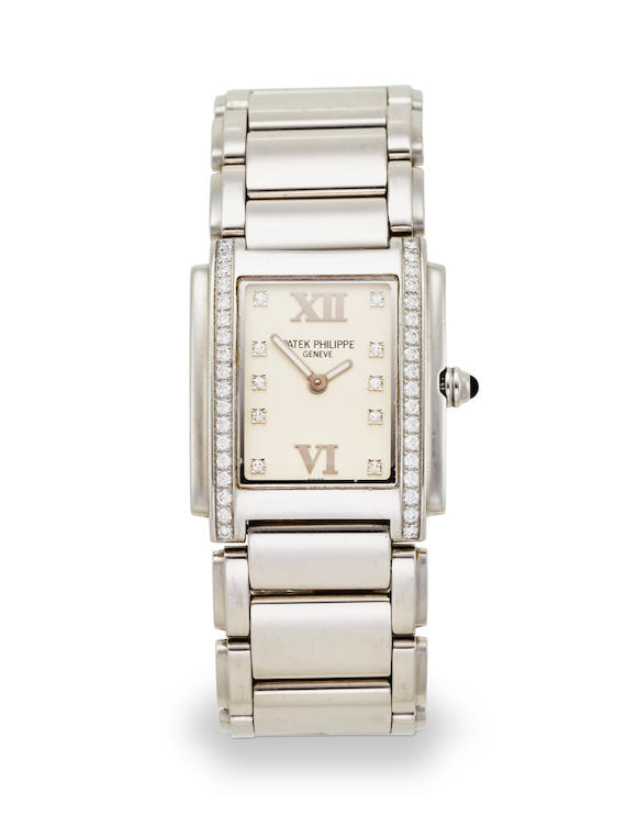 Bonhams : PATEK PHILIPPE. A LADY'S STAINLESS STEEL AND DIAMOND SET ...