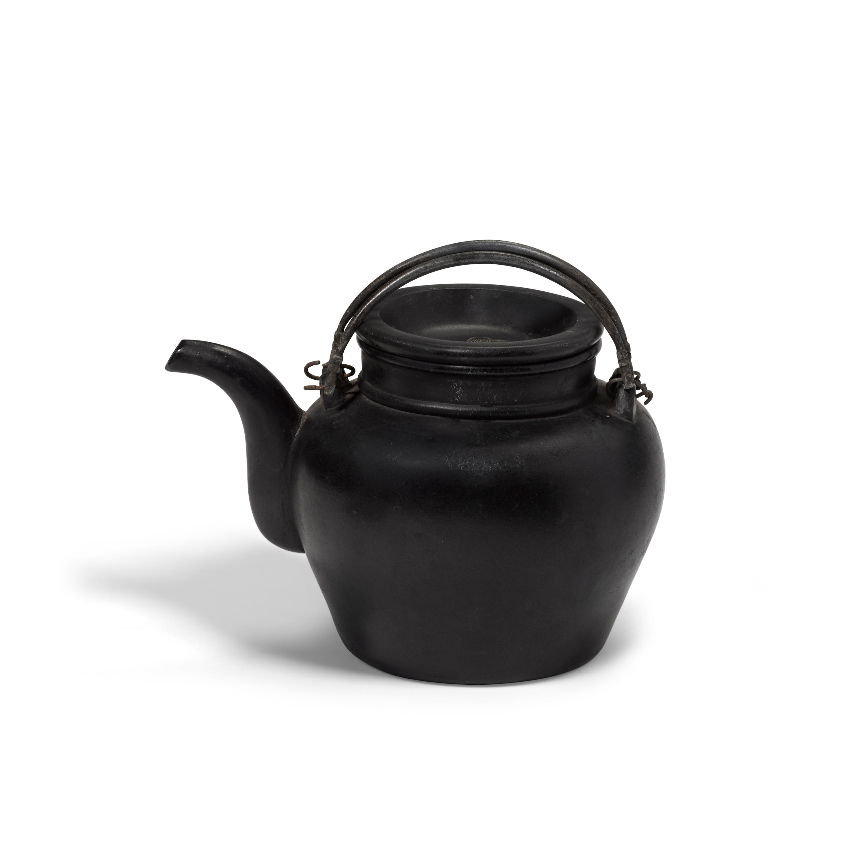 A black yixing teapot and cover