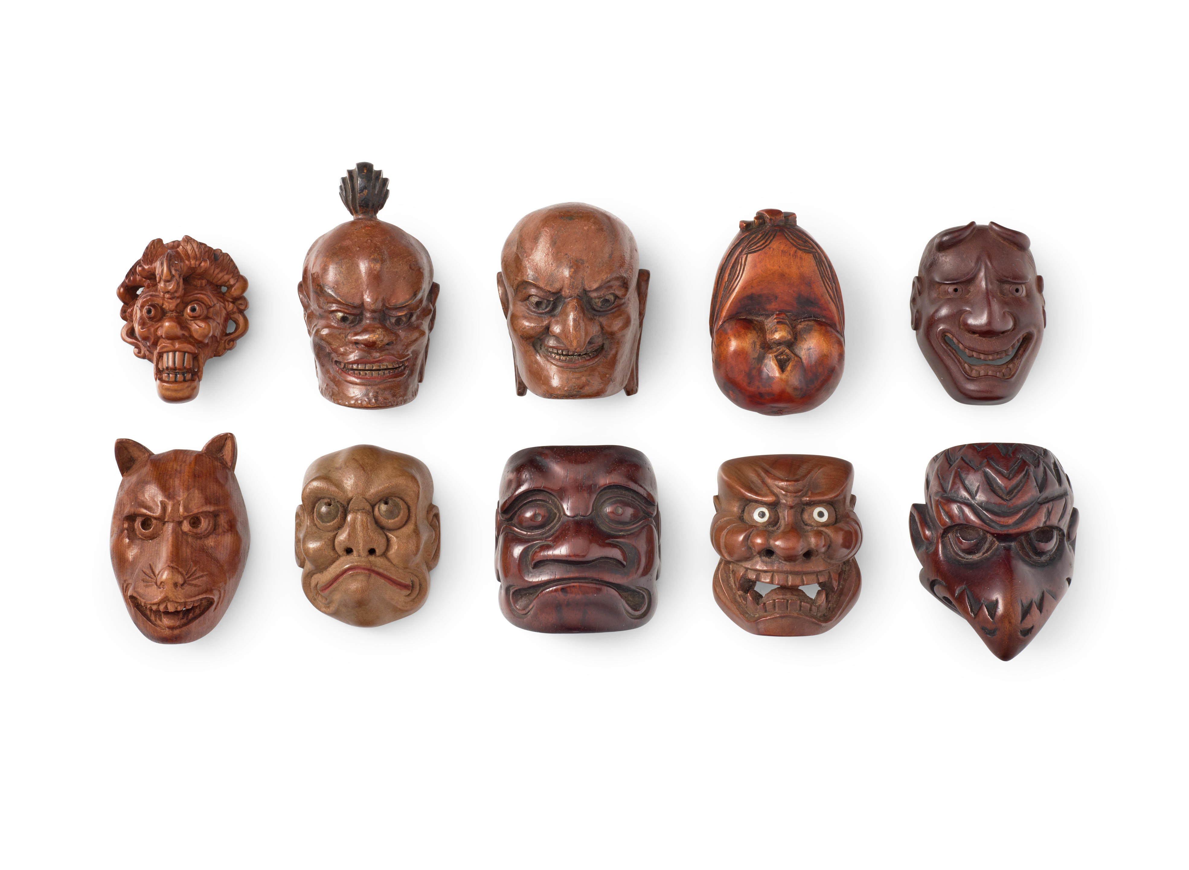 A group of ten wood mask netsuke