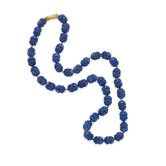 Bonhams : A CARVED LAPIS LAZULI BEAD NECKLACE