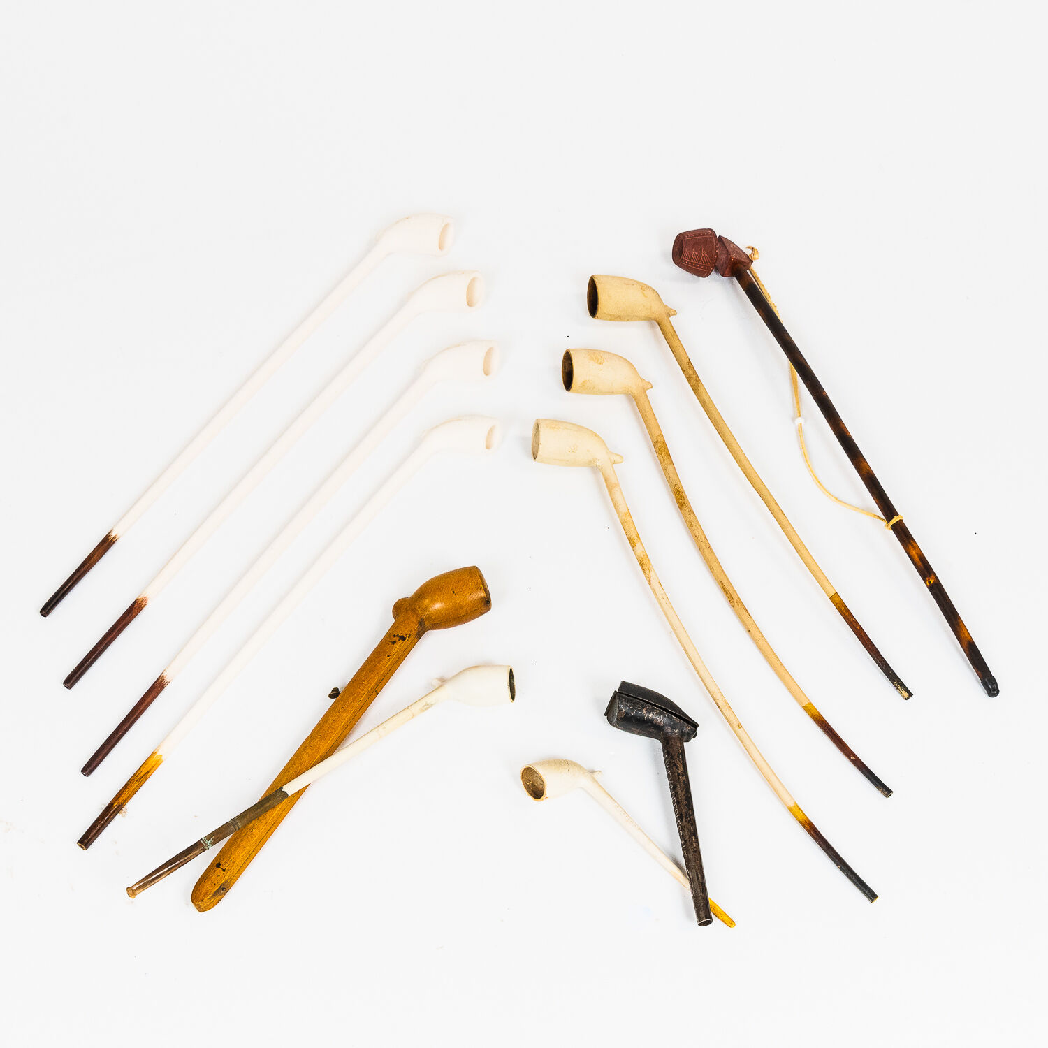 Bonhams Skinner Group of Mostly Kaolin Clay Smoking Pipes