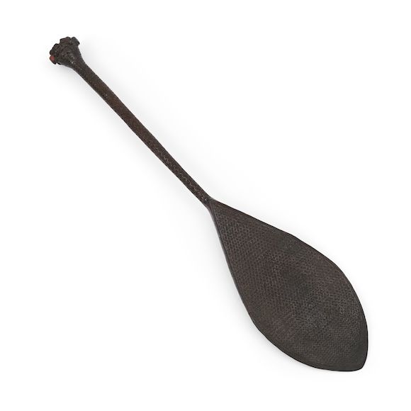 Bonhams Skinner An Austral Islands carved wood paddle lg. 30 3/4 in.