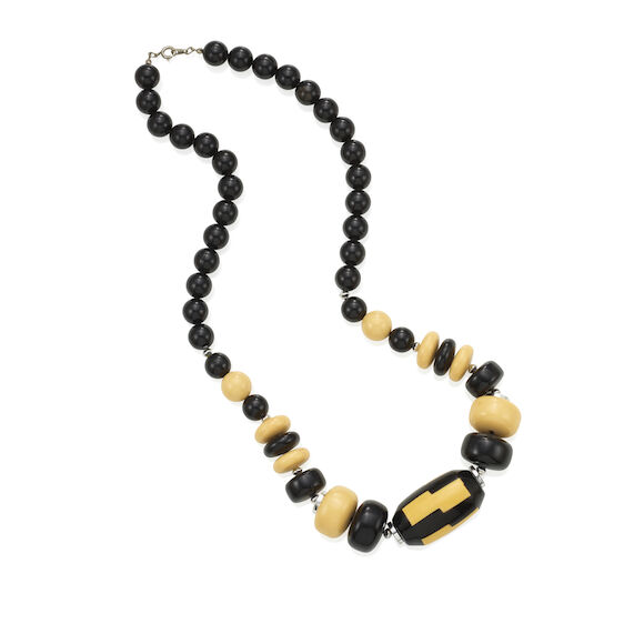 Bonhams A BLACK AND CREAM BAKELITE BEAD NECKLACE with one large