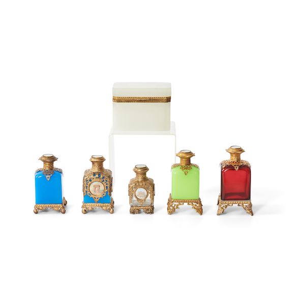 Bonhams Skinner Five Colored Glass Cologne Bottles and an Opaque