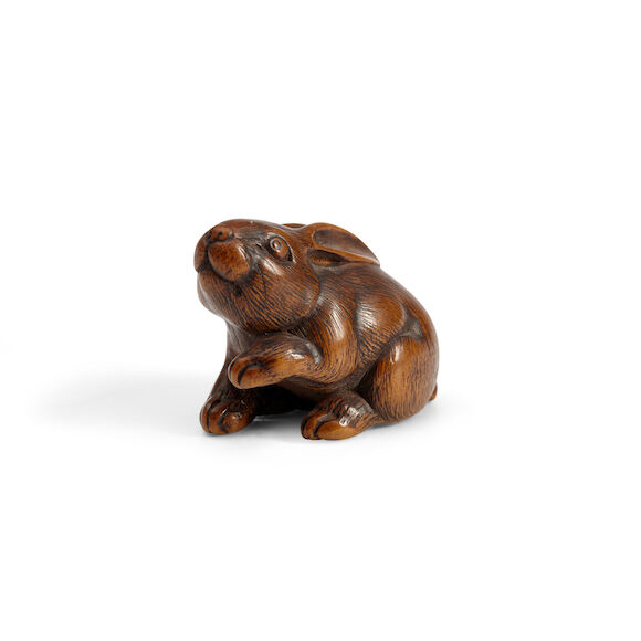 Bonhams Skinner : A WOOD NETSUKE OF A HARE